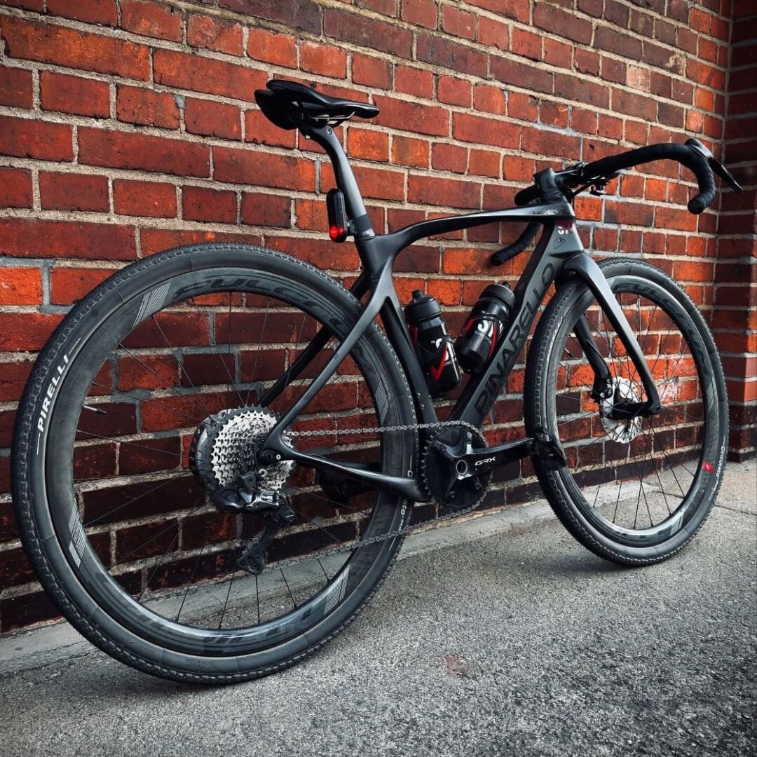 Black Pinarello Dogma road bike with Garmin Varia rear radar light mounted on aero seatpost